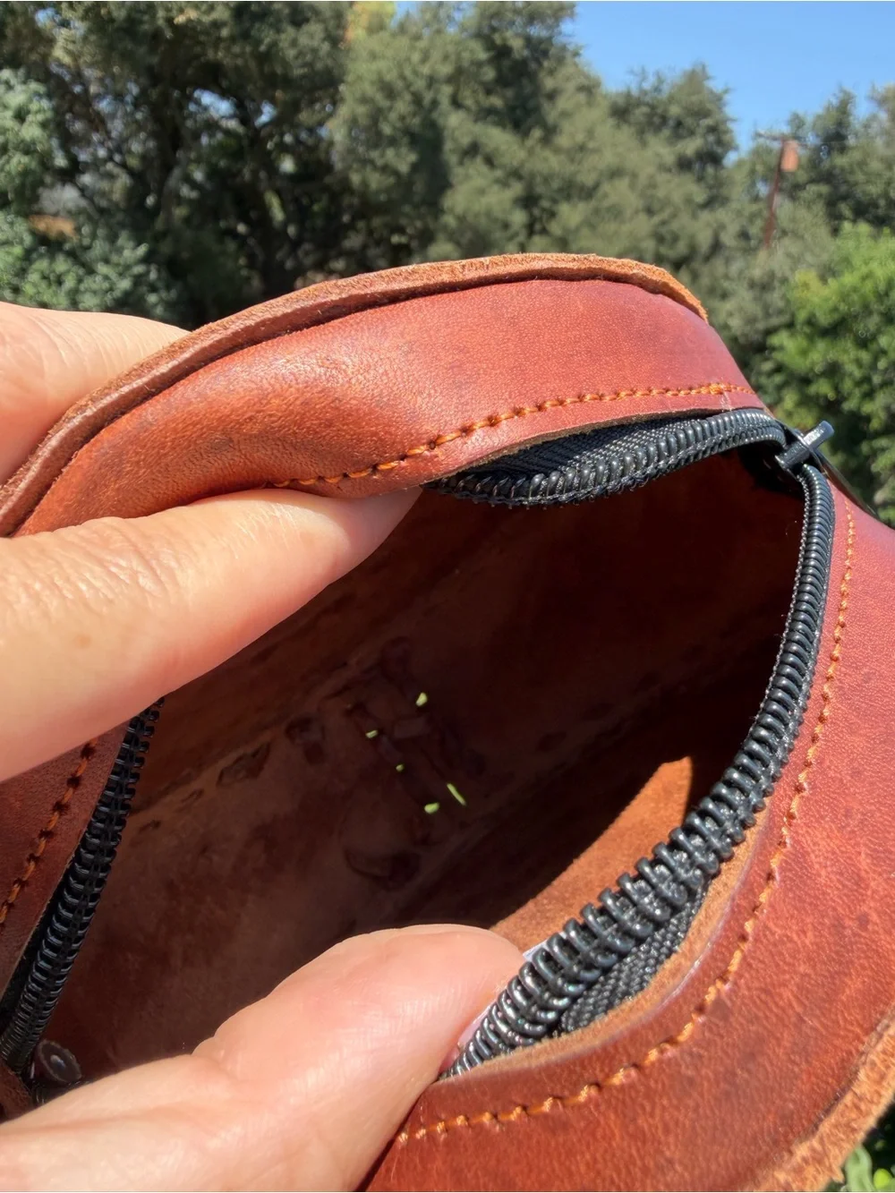 Hand-Tooled Round Leather Wristlet Bag with Colorful Woven Strap